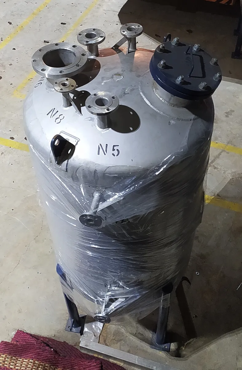 Fabricated reactor vessel with nozzles, wrapped for dispatch